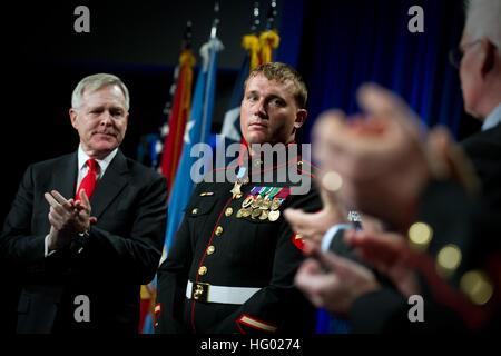 110914-N-UH963-182 WASHINGTON (Sept. 16, 2011) Medal of Honor recipient former Marine Corps Sgt. Dakota Meyer, 2nd from left, is recognized by Secretary of the Navy (SECNAV) the Honorable Ray Mabus during an induction ceremony at the Hall of Heros in the Pentagon. Meyer was awarded the Medal of Honor for actions in Afghanistan on Sept. 8, 2010. Meyer saved 13 U.S. Marines and Soldiers and 23 Afghans. (U.S. Navy photo by Mass Communication Specialist 1st Class Kevin S. O'Brien/Released) US Navy 110914-N-UH963-182 Medal of Honor recipient former Marine Corps Sgt. Dakota Meyer, 2nd from left, is  Stock Photo