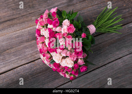 Roses on a wooden boards. Stock Photo