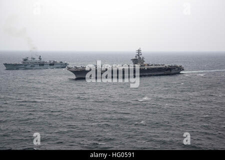 161125-N-QY430-007 ARABIAN GULF (Nov. 25, 2016) The aircraft carrier USS Dwight D. Eisenhower (CVN 69) (Ike) transits the Arabian Gulf alongside Royal Navy ship HMS Ocean (L12) during a Combined Task Force (CTF) 50 handover ceremony. Ike and its carrier strike group are deployed in support of Operation Inherent Resolve, maritime security operations and theater security cooperation efforts in the U.S. 5th Fleet area of operations. (U.S. Navy photo by Petty Officer 1st Class Rafael Martie/Released) USS Dwight D. Eisenhower (CVN-69) and HMS Ocean (L12) underway in the Arabian Gulf on 25 November  Stock Photo