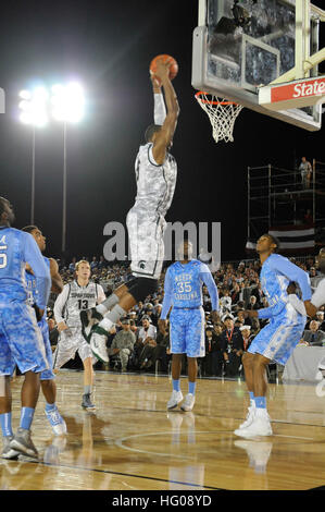 111111-N-OK922-242 SAN DIEGO (Nov. 11, 2011) Michigan State University center Adreian Payne scores against the University of North Carolina during the Quicken Loans Carrier Classic basketball game aboard the Nimitz-class aircraft carrier USS Carl Vinson (CVN 70). The inaugural Carrier Classic is a celebration of Veterans Day. ((U.S. Navy photo by Mass Communication Specialist 3rd Class Roza Arzola/Released) US Navy 111111-N-OK922-242 Michigan State University center Adreian Payne scores against the University of North Carolina during the Quicken Loans Stock Photo