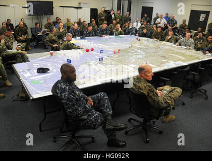 111115-N-ZO696-019 VIRGINIA BEACH, Va. (Nov. 15, 2011) Rear Adm. Kevin Scott and Brig. Gen. Chris Owens lead a planning discussion at Expeditionary Warfare Training Group Atlantic at Joint Expeditionary Base Little Creek/Fort Story. Bold Alligator represents the Navy and Marine Corps' revitalization of the fundamentals of amphibious operations, strengthening their traditional role as fighters from the sea. (U.S. Navy photo by Mass Communication Specialist 1st Class Phil Beaufort/Released) US Navy 111115-N-ZO696-019 Rear Adm. Kevin Scott and Brig. Gen. Chris Owens lead a planning discussion at  Stock Photo