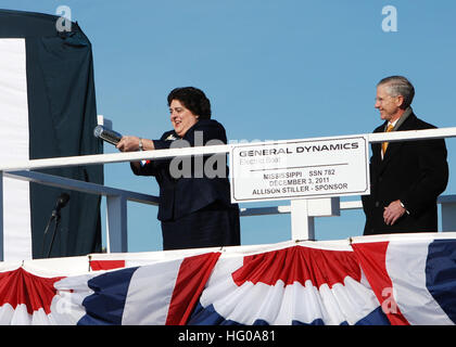 111203-N-AW324-148 GROTON, Conn. (Dec. 3, 2011) Ship sponsor Allison Stiller, left, prepares to christen the Virginia-class attack submarine Pre-Commissioning Unit (PCU) Mississippi (SSN 782) as John Casey, president of General Dynamics Electric Boat, looks on during a christening ceremony in Groton, Conn. Mississippi is the ninth Virginia-class submarine and the fifth U.S. Navy ship to be named for the Magnolia State. (U.S. Navy photo by Mass Communication Specialist 1st Class Virginia K. Schaefer/Released) US Navy 111203-N-AW324-148 Ship sponsor Allison Stiller, left, prepares to christen th Stock Photo