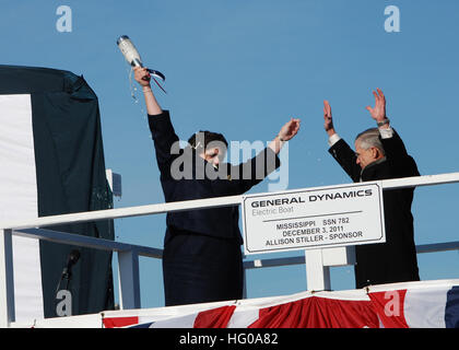 111203-N-AW324-151 GROTON, Conn. (Dec. 3, 2011) Ship sponsor Allison Stiller, left, and John Casey, president of General Dynamics Electric boat, celebrate after christening the Virginia-class attack submarine Pre-Commissioning Unit (PCU) Mississippi (SSN 782). Mississippi is the ninth Virginia-class submarine and the fifth U.S. Navy ship to be named for the Magnolia State. (U.S. Navy photo by Mass Communication Specialist 1st Class Virginia K. Schaefer/Released) US Navy 111203-N-AW324-151 Ship sponsor Allison Stiller, left, and John Casey, president of General Dynamics Electric boat, celebrate Stock Photo