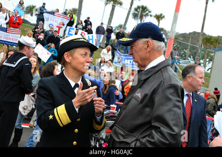 111208-N-DG679-081 MAYPORT, Fla. (Dec. 8, 2011) Rear Adm. Nora Tyson, commander of Carrier Strike Group (CSG) 2, speaks with Vice President Joe Biden while they wait for the return of the guided-missile cruiser USS Gettysburg (CG 64). Gettysburg returned from a seven-month deployment with the George H.W. Bush Carrier Strike Group supporting Operations Enduring Freedom and New Dawn along with theater and maritime security cooperation efforts in the Mediterranean and Arabian Seas. (U.S. Navy photo by Mass Communication Specialist 1st Class Toiete Jackson/Released) US Navy 111208-N-DG679-081 ear  Stock Photo