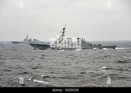 130313-N-BX824-228  WATERS TO THE EAST OF THE KOREAN PENINSULA (March 13, 2013) The Arleigh Burke-class guided-missile destroyer USS Fitzgerald (DDG 62), right, conducts tactical maneuvers with a ship from the Republic of Korea navy. Fitzgerald is part of Destroyer Squadron 15, forward deployed to Yokosuka, Japan, and is underway to conduct exercise Foal Eagle 2013 with allied nation Republic of Korea in support of regional security and stability of the Asia-Pacific region. (U.S. Navy photo by Mass Communication Specialist 3rd Class Ricardo R. Guzman/Released) Join the conversation http://www. Stock Photo