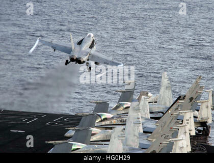 130313-N-XQ474-251 MEDITERRANEAN SEA (March 13, 2013) An F/A-18C Hornet assigned to the Wildcats of Strike Fighter Squadron (VFA) 131 launches from the flight deck of the aircraft carrier USS Dwight D. Eisenhower (CVN 69). Dwight D. Eisenhower departed Naval Station Norfolk on a scheduled deployment in support of maritime security operations and theater security cooperation efforts in the U.S. 5th and 6th Fleet areas of responsibility. (U.S. Navy photo by Mass Communication Specialist Seaman Andrew Schneider/Released) Join the conversation http://www.facebook.com/USNavy http://www.twitter.com/ Stock Photo