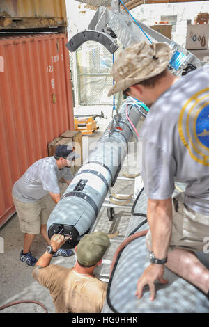 130611-N-AZ907-225 U.S. 5TH FLEET AREA OF RESPONSIBILITY, Bahrain (June 11, 2013) Members of the Unmanned Underwater Vehicle (UUV) detachment, Commander, Task Group (CTG) 56.1, transfer a UUV from a rigid hull inflatable boat following a training exercise. CTG 56.1 provides mine countermeasures, explosive ordnance disposal, salvage diving, force protection and promotes theater security cooperation efforts in the U.S. 5th Fleet area of responsibility. (U.S. Navy photo by Mass Communication Specialist 1st Class Peter Lewis/Not Released) UUV operations 130611-N-AZ907-225 Stock Photo