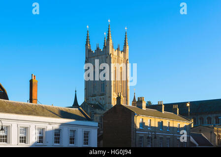 Bury St Edmunds cathedral, view of the Millennium Tower of Bury St Edmunds Cathedral visible above buildings on Angel Hill, Suffolk, UK Stock Photo