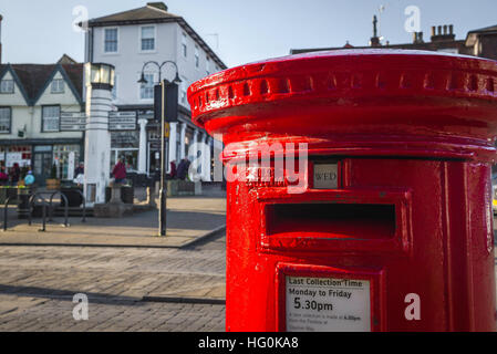 Red pillar box, view of the upper detail of a red pillar box sited on Angel Hill in Bury St Edmunds, Suffolk, UK. Stock Photo