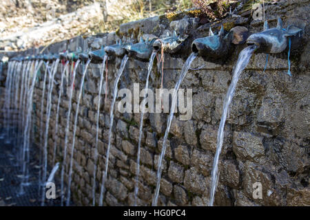 Wall Fountain at sacred Muktinath temple in Annapurna Region in Nepal Stock Photo