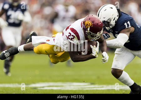 January 2, 2017 - California, USA -   USC running back Justin Davis (22) dives while being hit by Penn State linebacker Brandon Bell (11) in the first half during the Rose Bowl Game between Penn State Nittany Lions and University of Southern California Trojans at Rose Bowl Stadium in Pasadena, California.  USC won 52-49. (Credit Image: © Scott Taetsch via ZUMA Wire) Stock Photo