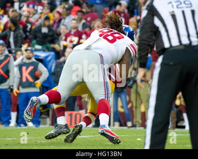 New York Giants defensive tackle Barry Cofield holds up a newspaper  proclaiming the Giants' win over the New England Patriots at Super Bowl  XLII at University of Phoenix Stadium in Glendale, Arizona