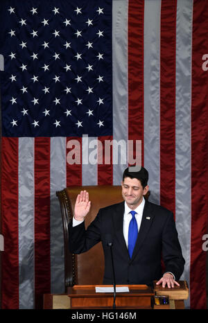 (170103) -- WASHINGTON, Jan. 3, 2017 (Xinhua) -- Paul Ryan is sworn in after being re-elected as House Speaker during the opening of the 115th U.S. Congress on Capitol Hill in Washington D.C., the United States, on Jan. 3, 2017. The 115th U.S. Congress convenes on Tuesday with Republican Paul Ryan re-elected as House Speaker as expected while outgoing Vice President Joe Biden presides over the old Senate chamber for the last time. (Xinhua/Yin Bogu) Stock Photo