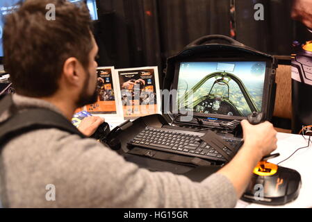 Las Vegas, Nevada, USA, 2nd January, 2017.  Attendee testing out Thrustmaster’s new T.1600M FCS Flight Pack at Thrustmaster’s booth during 'CES Unveiled,' a media preview event for the CES (Consumer Electronics Show). CES, the world's largest annual consumer electronics trade show, runs from January 5-8 and is expected to feature 3,800 exhibitors showing off their latest services and products to more than 165,000 attendees representing more than 150 countries.  John D. Ivanko/Alamy Live News Stock Photo