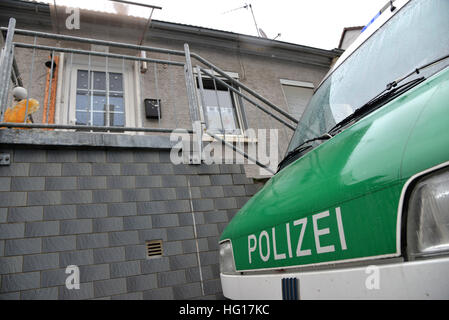 Lauterecken, Germany. 04th Jan, 2017. A police vehicle is parked outside a house where the police found more than 110 kilograms of pyrotechnic material during a search on 02 January 2017 in Lauterecken, Germany, 04 January 2017. Two detained men are being investigated on suspicion of violation of the explosives law and for preparing a severe criminal offence. According to the district attorney's office, they had planned an explosives attack in Kaiserslautern on New Year's Eve 2016. The explosives are to be recovered from the house on 08 January 2017. Photo: Harald Tittel/dpa/Alamy Live News Stock Photo