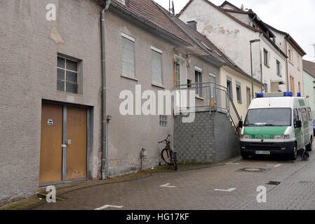 Lauterecken, Germany. 04th Jan, 2017. A police vehicle is parked outside a house where the police found more than 110 kilograms of pyrotechnic material during a search on 02 January 2017 in Lauterecken, Germany, 04 January 2017. Two detained men are being investigated on suspicion of violation of the explosives law and for preparing a severe criminal offence. According to the district attorney's office, they had planned an explosives attack in Kaiserslautern on New Year's Eve 2016. The explosives are to be recovered from the house on 08 January 2017. Photo: Harald Tittel/dpa/Alamy Live News Stock Photo