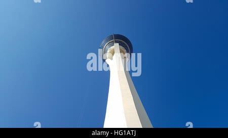 View at the top of the Stratosphere Hotel in Las Vegas, Nevada. The very  top of the tower, the 'Big Shot' ride, is pictured against a blue cloudy  sky. Copy space on