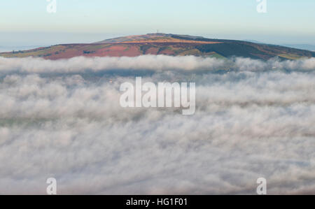 Mist swirls around Brown Clee Hill in Shropshire, England, UK. Stock Photo