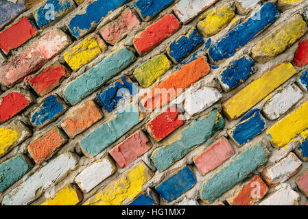 Multicolored painted bricks, exterior wall as background, urban pattern Stock Photo