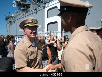 Capt. Robert A. Hall Jr., commanding officer of future amphibious assault ship USS America (LHA 6), congratulates Chief Air Traffic Controller Fernando Montes at the conclusion of a chief petty officer pinning ceremony aboard future amphibious assault ship USS America (LHA 6). This year marks the first time a chief pinning ceremony was held aboard the ship. America is the first ship of its class, replacing the Tarawa-class of amphibious assault ships. As the next generation 'big-deck' amphibious assault ship, America is optimized for aviation, capable of supporting current and future aircraft  Stock Photo