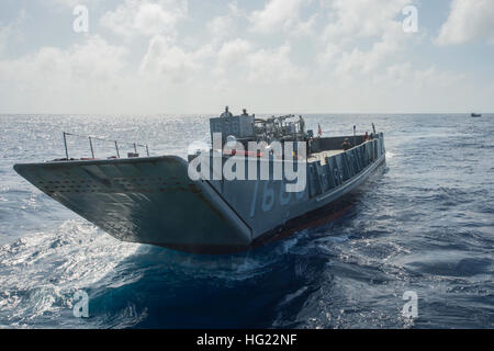 Landing Craft Utility (LCU) 1666, assigned to Naval Beach Unit (NBU) 7, prepares to embark the well deck of the amphibious dock landing ship USS Germantown (LSD 42) during exercise Blue Chromite. Blue Chromite is an amphibious training exercise with the 4th Marine Regiment and the 2nd Battalion, 9th Marines. Germantown is part of the Peleliu Amphibious Ready Group (#PELARG14), commanded by Capt. Heidi Agle, and is conducting joint forces exercises in the U.S. 7th Fleet area of responsibility. (U.S. Navy photo by Mass Communication Specialist Seaman Patrick Dionne/Released) USS Germantown opera Stock Photo