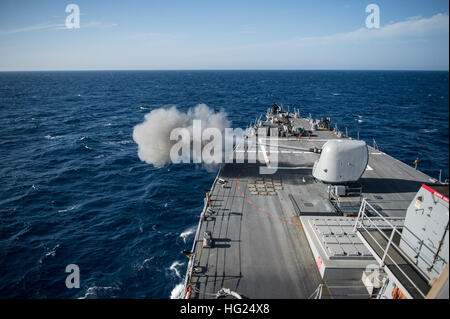 EDITERRANEAN SEA (Feb. 26, 2015) The guided-missile destroyer USS Donald Cook (DDG 75) conducts a live-fire gunnery exercise with the MK 45 5-inch gun as part of a passing exercise with the French navy frigate La Fayette (F 710). Donald Cook is forward-deployed to Rota, Spain, and is conducting naval operations in the U.S. 6th Fleet area of responsibility in support of U.S. national security interests in Europe. (U.S. Navy photo by Mass Communication Specialist 2nd Class Karolina A. Oseguera/Released) 150226-N-JN664-056  Join the conversation: http://www.navy.mil/viewGallery.asp http://www.fac Stock Photo