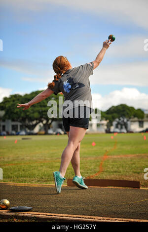 150309-N-WF272-162 PEARL HARBOR (March 9, 2015) Legalman 1st Class (retired) Shahnaz Askins participates in track and field throwing practice during the 2015 Wounded Warrior Pacific Trials at Quick Field on Joint Base Pearl Harbor-Hickam (JBPHH). The trials allow wounded, ill and injured Sailors and Coast Guardsmen from across the country to compete in cycling, seated volleyball, swimming, track and field, and wheelchair basketball at JBPHH and other locations throughout the island. The top 40 athletes will be awarded a spot on Team Navy and advance to a competition among all branches of the m Stock Photo