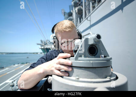 150522-N-MU551-143 USS Harry S. Truman, at sea – (May 22, 2015) Quartermaster Seaman A.J. Talbot takes a bearing with an alidade from the bridge wing of aircraft carrier USS Harry S. Truman (CVN 75). Truman is currently conducting sea trials, an at-sea shipboard testing of systems and equipment, following a successful condensed availability. (U.S. Navy photo by Mass Communication Specialist Seaman M. M. Gillan/Released) USS Harry S. Truman action 150522-N-MU551-143 Stock Photo