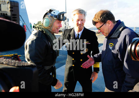 150703-N-GR655-056 SYDNEY, Australia (July 3, 2015) – Australian Prime Minister Tony Abbott, left, is greeted by John Berry, U.S. Ambassador to Australia, right, and Vice Adm. Robert Thomas, U.S. 7th Fleet commander after arriving on board the U.S. 7th Fleet flagship USS Blue Ridge (LCC-19) for a tour before the start of the Australia-U.S. exercise Talisman Saber 2015. Talisman Saber is a biennial combined joint exercise designed to improve Australian and U.S. combat readiness and interoperability, maximize combined training opportunities and demonstrate U.S. resolve to support the security op Stock Photo