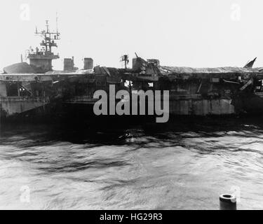 View of Princeton's port midships area, showing her collapsed forward aircraft elevator and shattered flight deck, the results of explosions in her hangar deck following a Japanese bomb hit off the Philippines on 24 October 1944. Photographed from USS Birmingham (CL-62), which was coming alongside to assist with firefighting. Official U.S. Navy Photograph, now in the collections of the National Archives. USS Princeton (CVL-23) damaged 1 Stock Photo