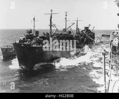 USS Guadalupe (AO-32) refuels USS Maury (DD-401) and USS Lexington (CV-16) in November 1943 Stock Photo