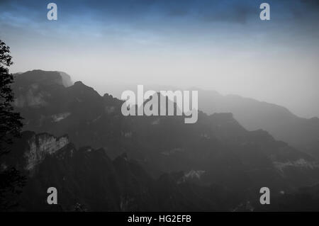 The mountains and rocky cliffs of tianmen or Tianmen shan near the city of  Zhangjiajie in Hunan province China. Stock Photo