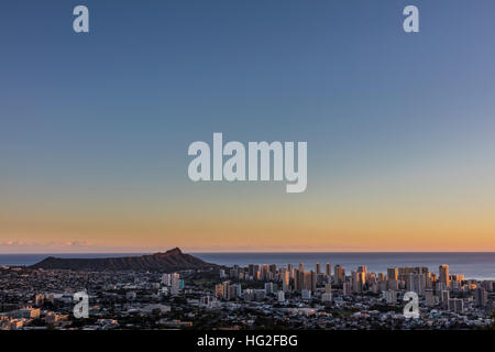 Last light shinning on the towers in Waikiki from Tantalus Drive scenic overlook in Honolulu. Stock Photo