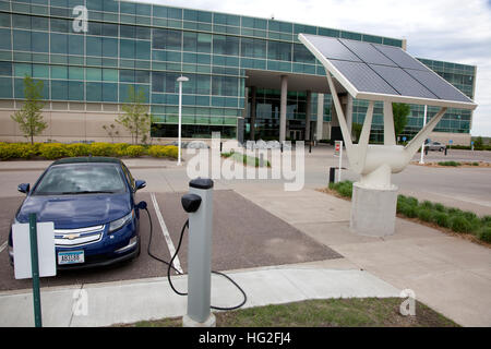 Electric battery operated Chevy volt being charged in Great River Energy headquarters parking lot. Maple Grove Minnesota MN USA Stock Photo