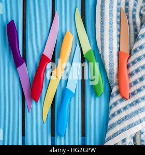 Set of Colorful Kitchen Knives on kitchen napkin Stock Photo