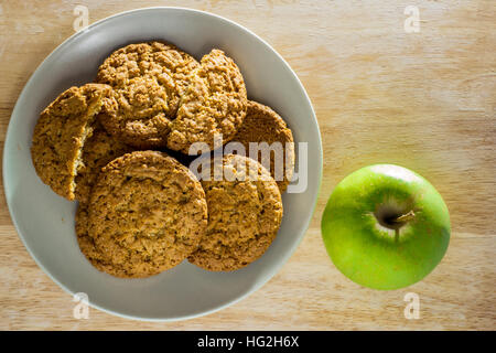 Oatmeal cookies with apple top view Stock Photo