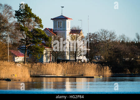 Ronneby, Sweden - January 2, 2017: Documentary of coastal lifestyle. Lovely seaside home with lookout tower very close to the sea visible in the foreg Stock Photo