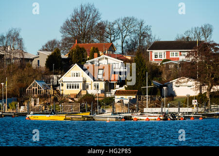 Ronneby, Sweden - January 2, 2017: Documentary of coastal lifestyle. The marina and some nearby homes at Ekenas. Stock Photo