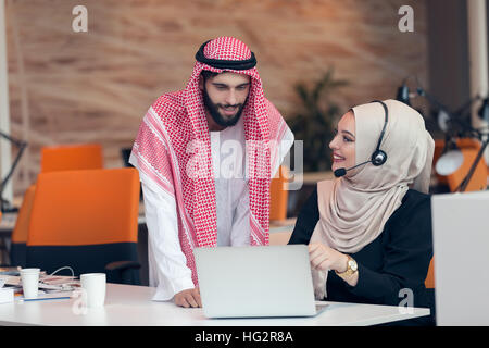 Arabic business couple working together on project at modern startup office Stock Photo