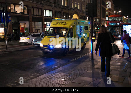 London ambulance on way to a emergency at night Stock Photo