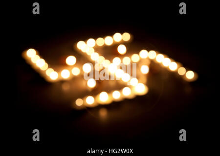 Oil lamps in formation of Swastika Stock Photo