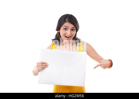 Portrait of a young Woman point to blank sign Stock Photo