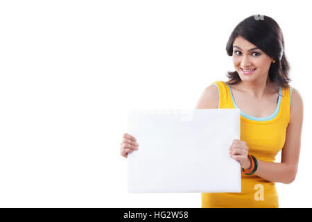 Portrait of a young Woman point to blank sign Stock Photo