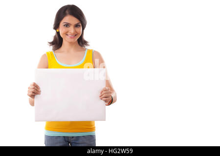 Portrait of a young Woman point to blank sign Stock Photo