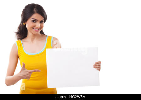 Portrait of a young Woman point to blank sign Stock Photo