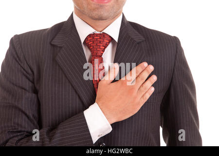 business man with his hand on his chest Stock Photo
