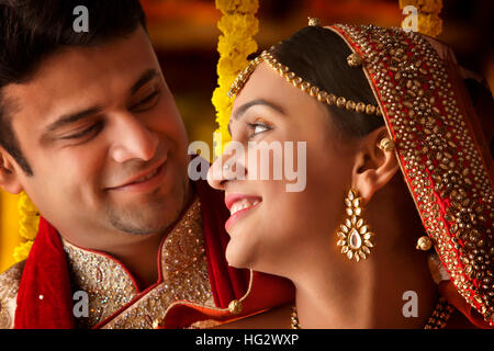 Handsome groom looking at beautiful bride , , young couple Stock Photo