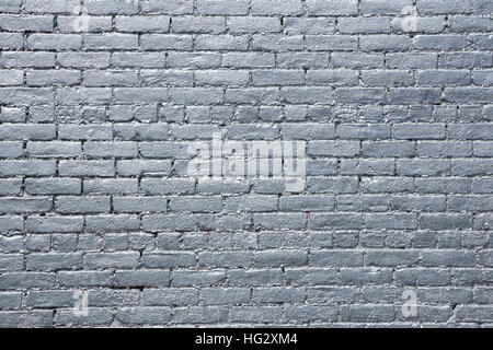 A brick wall is painted silver. Stock Photo