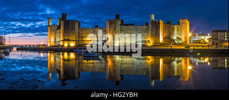 Panoramic View of Caernarfon Castle at Night Stock Photo