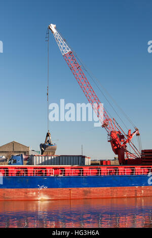 The Esprit cargo vessel off-loading aggregate at the Port of Great Yarmouth. Stock Photo